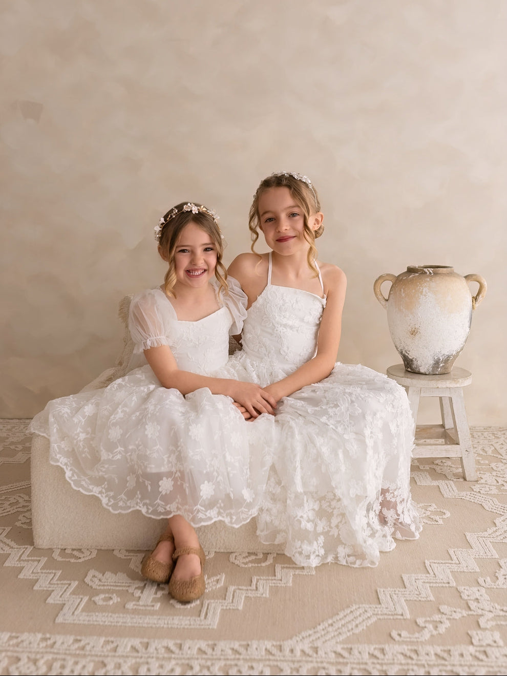 Romantic white flower girl gown with intricate 3D flower embellishments