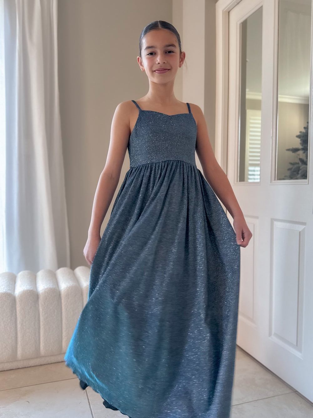 Claudia blue-green girls evening dress with flowing full-length skirt.