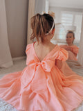 Peach girls dress with V-back design and soft cotton lining for weddings and parties.