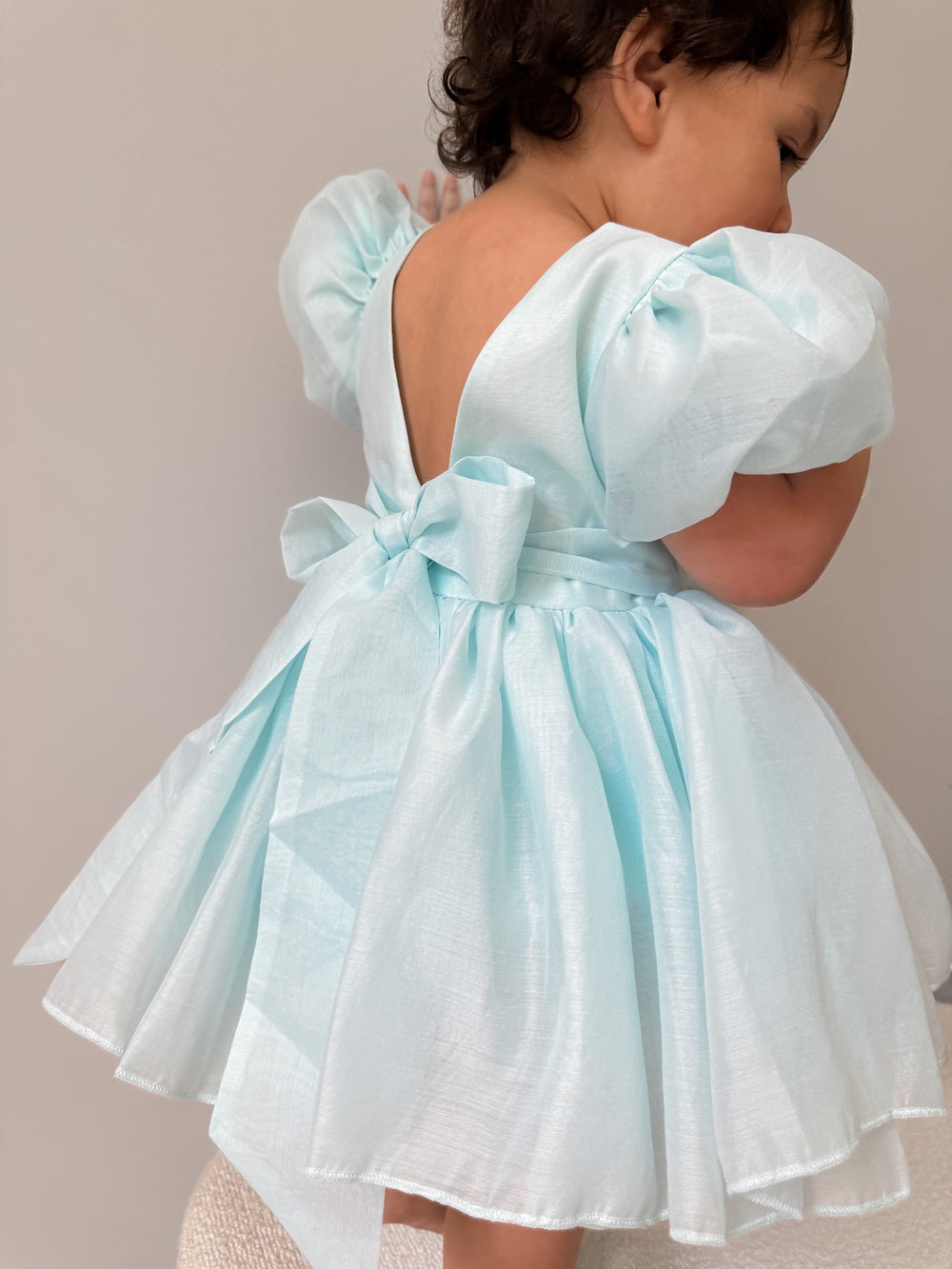 Delia Pale Blue Baby Dress styled with matching accessories