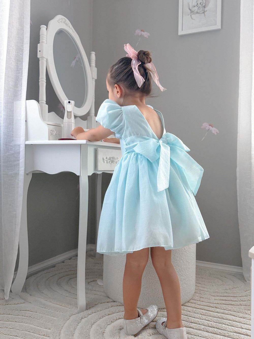 Light blue girls party dress below the knee with puff sleeves and cotton lining