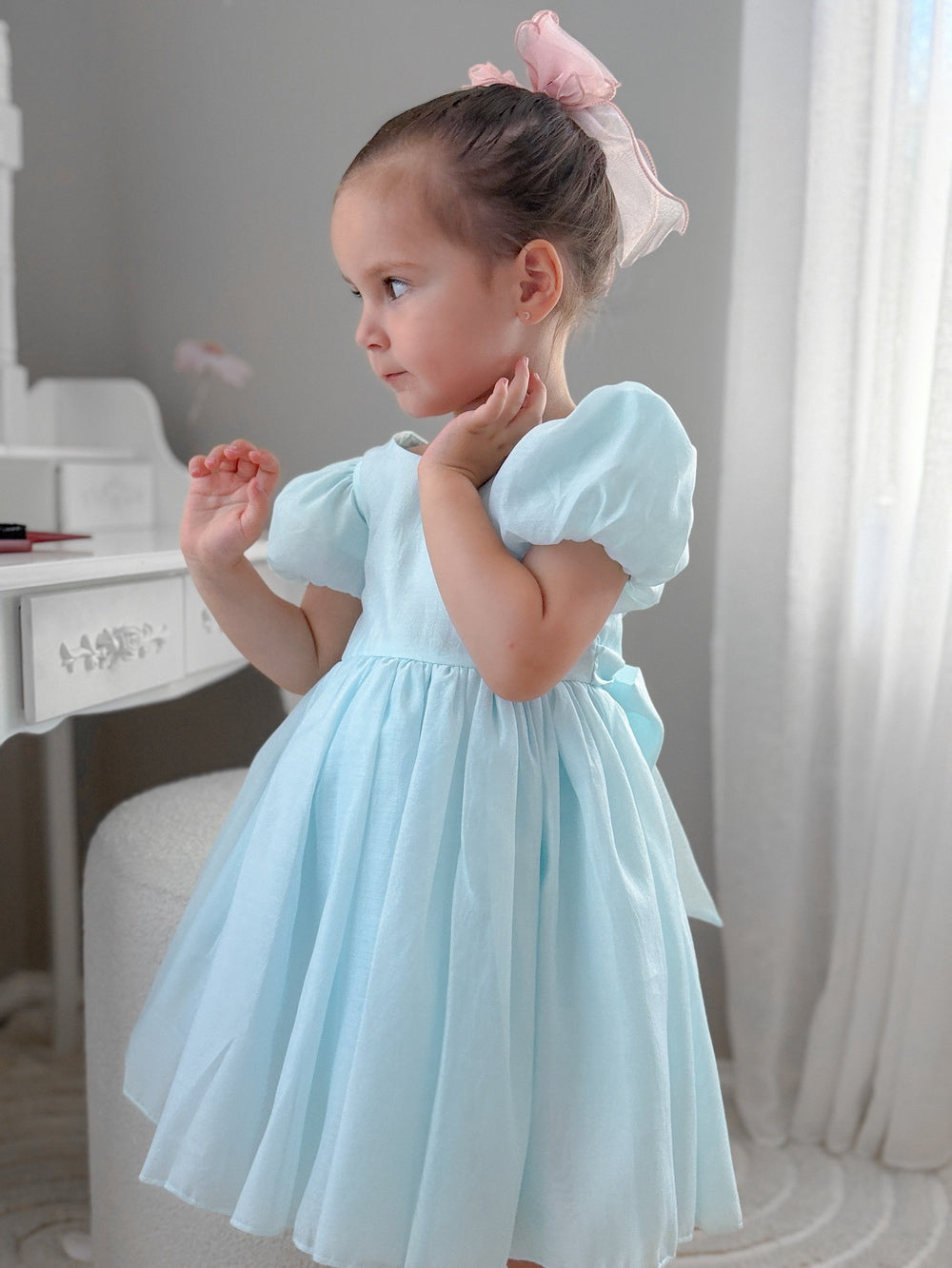 Pale blue girls special occasion dress with soft shimmer and classic silhouette