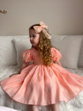 Peach flower girl dress with soft cotton lining and elegant silhouette — Delia collection