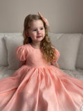 Peach girls special occasion dress with shimmer fabric and puff sleeves — Delia Dress front view