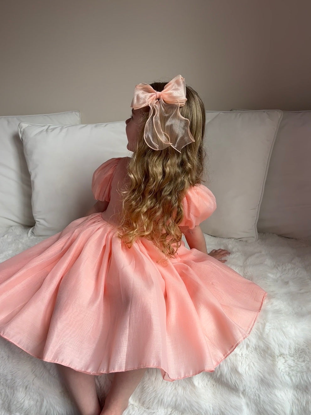 Peach flower girl hair bow with curled organza ribbons