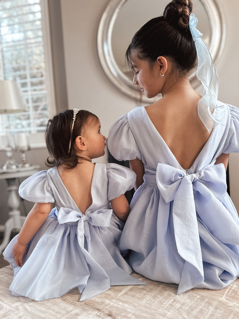 Sister matching dusty blue flower girl dresses