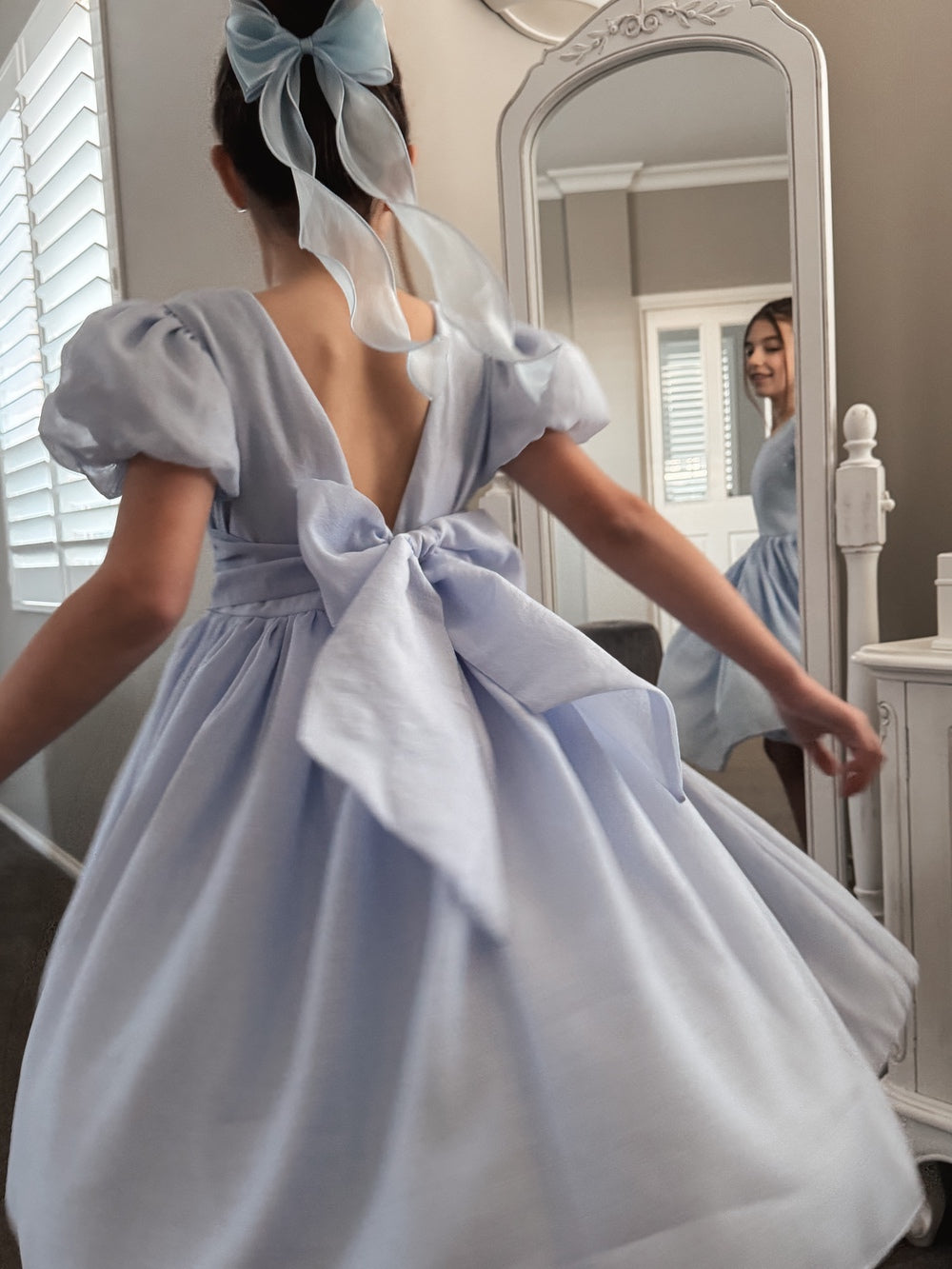 Pale blue flower girls dress with big bow V back