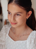 Elegant silver necklace with multiple sparkly charms for girls