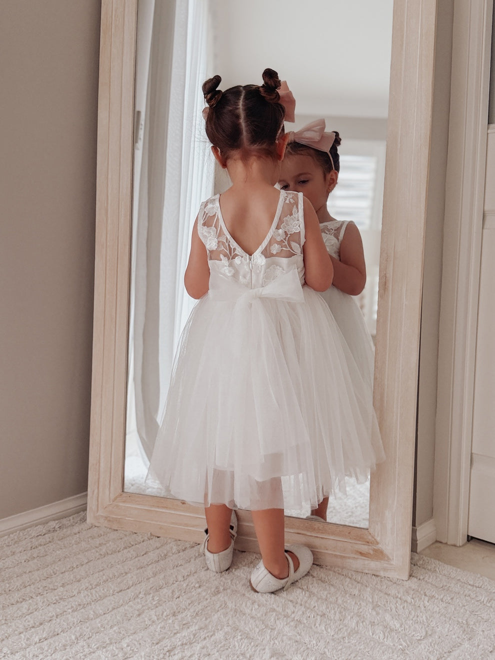 White girls tea length dress with zip back and statement bow