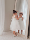 White communion dress for girls with sleeveless bodice and V-back