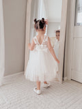 White communion dress for girls with sleeveless bodice and V-back