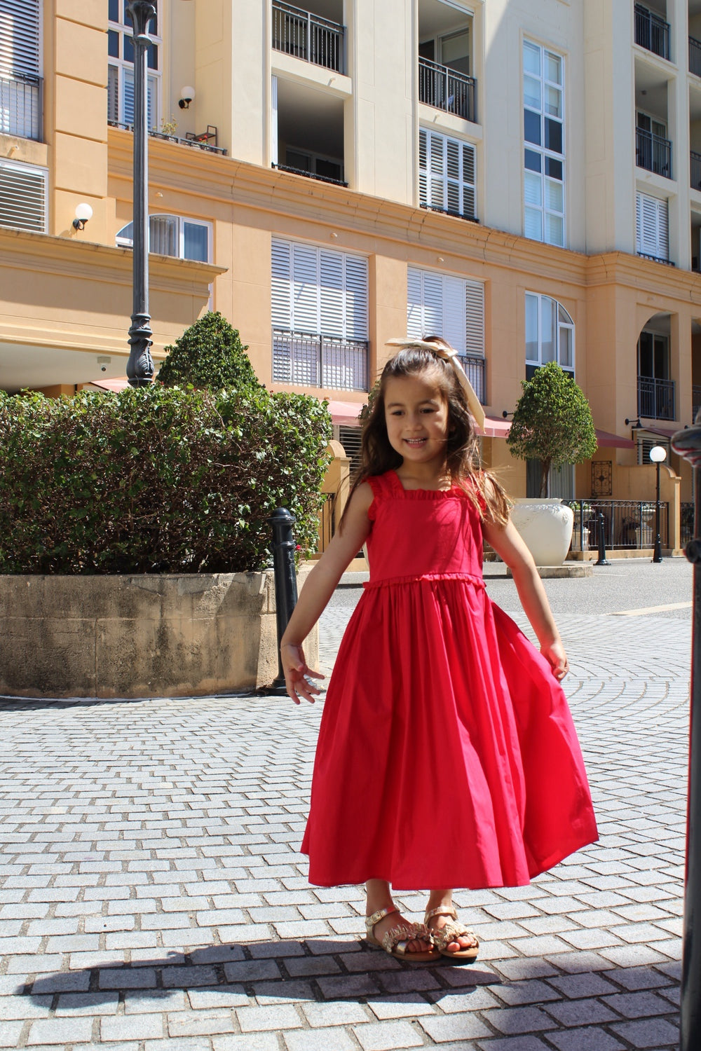 Eden Girls Midi Christmas Dress - Christmas Dresses and RompersEden Girls Midi Christmas Dress – vibrant red girls Christmas dress with ruffles and bow back
