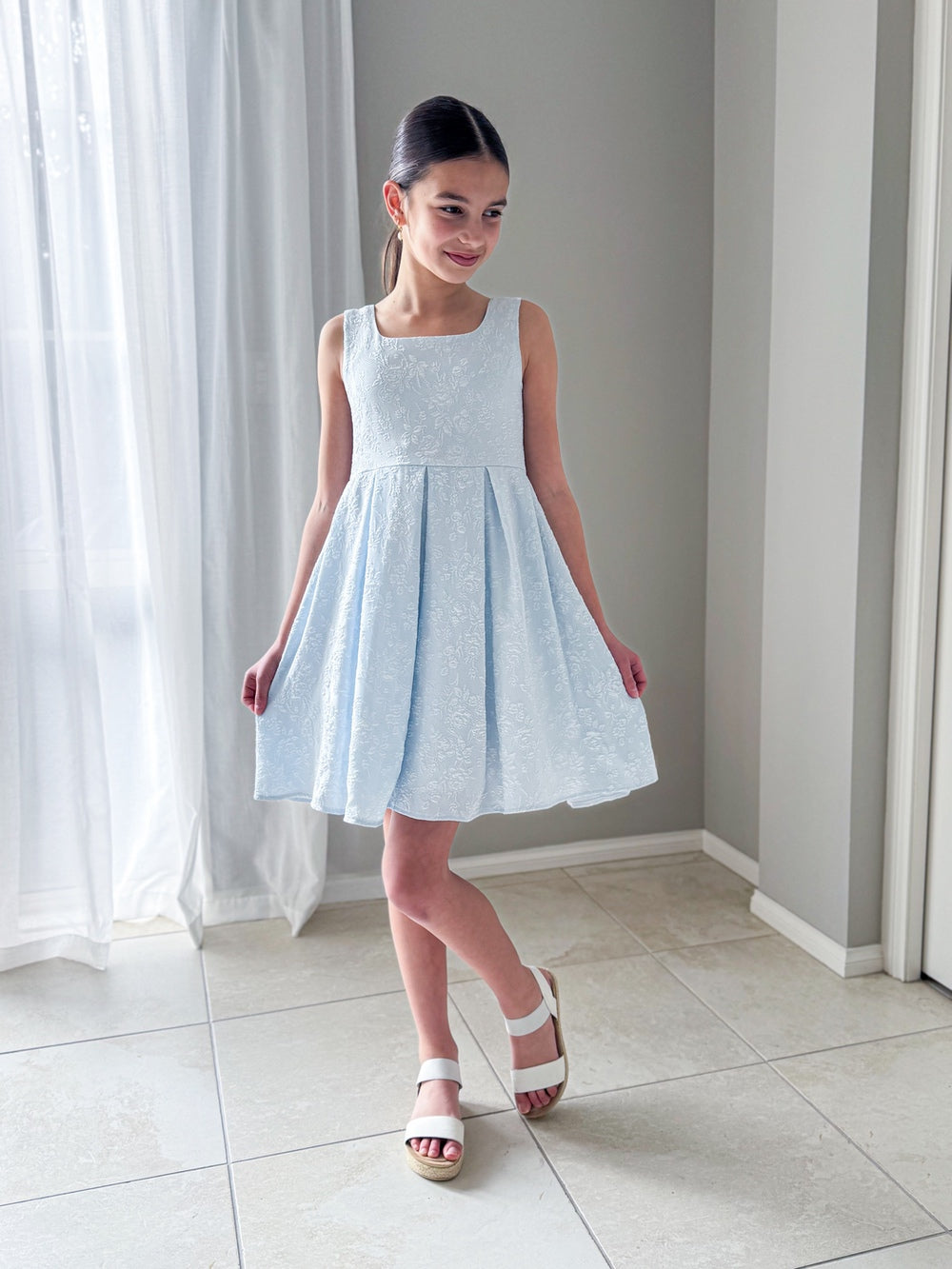 Emilee Light Blue Girls Graduation Dress - Tween Girls DressesClose-up of square neckline and floral embroidery details on the bodice