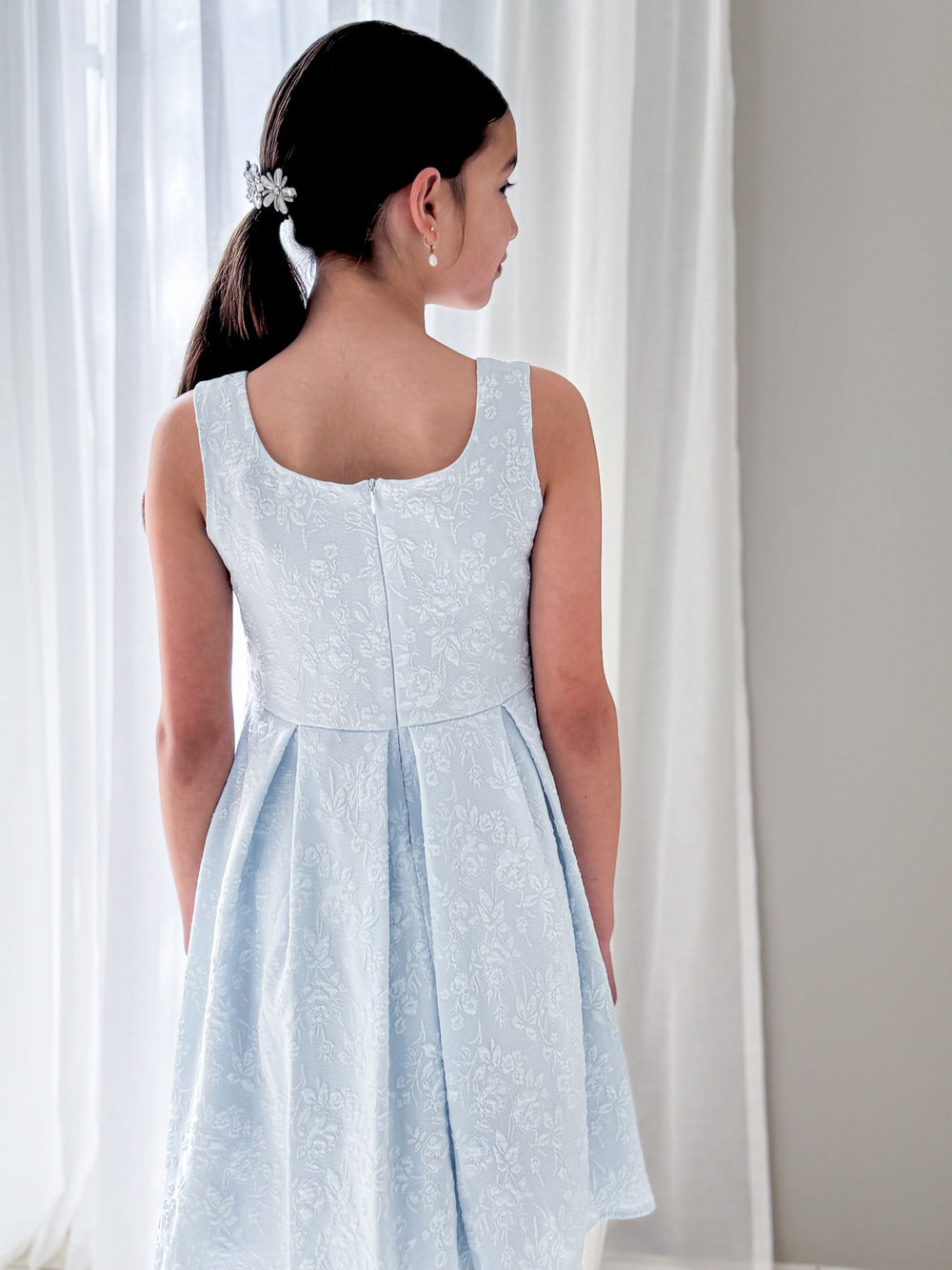 Emilee Light Blue Girls Graduation DressFull-length photo of girl in Emilee light blue dress mid-twirl