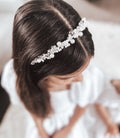 Close-up of silver pearl headband with alternating pearls and clear beads