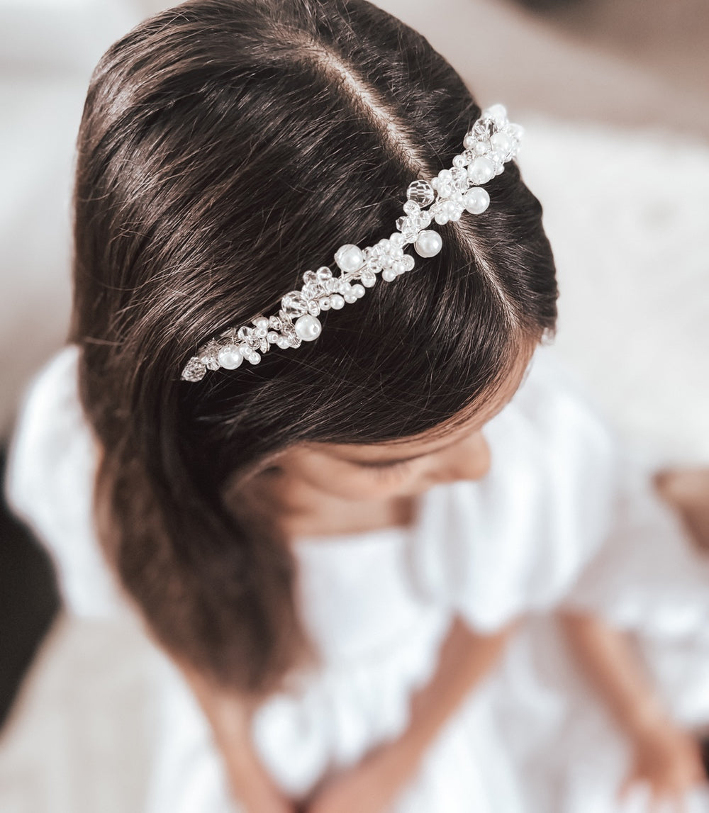 Close-up of silver pearl headband with alternating pearls and clear beads