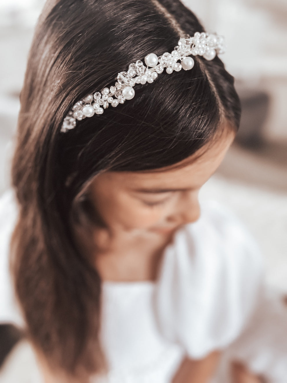 Side view of Silver Pearl Headband showing slim silver band and rounded ends
