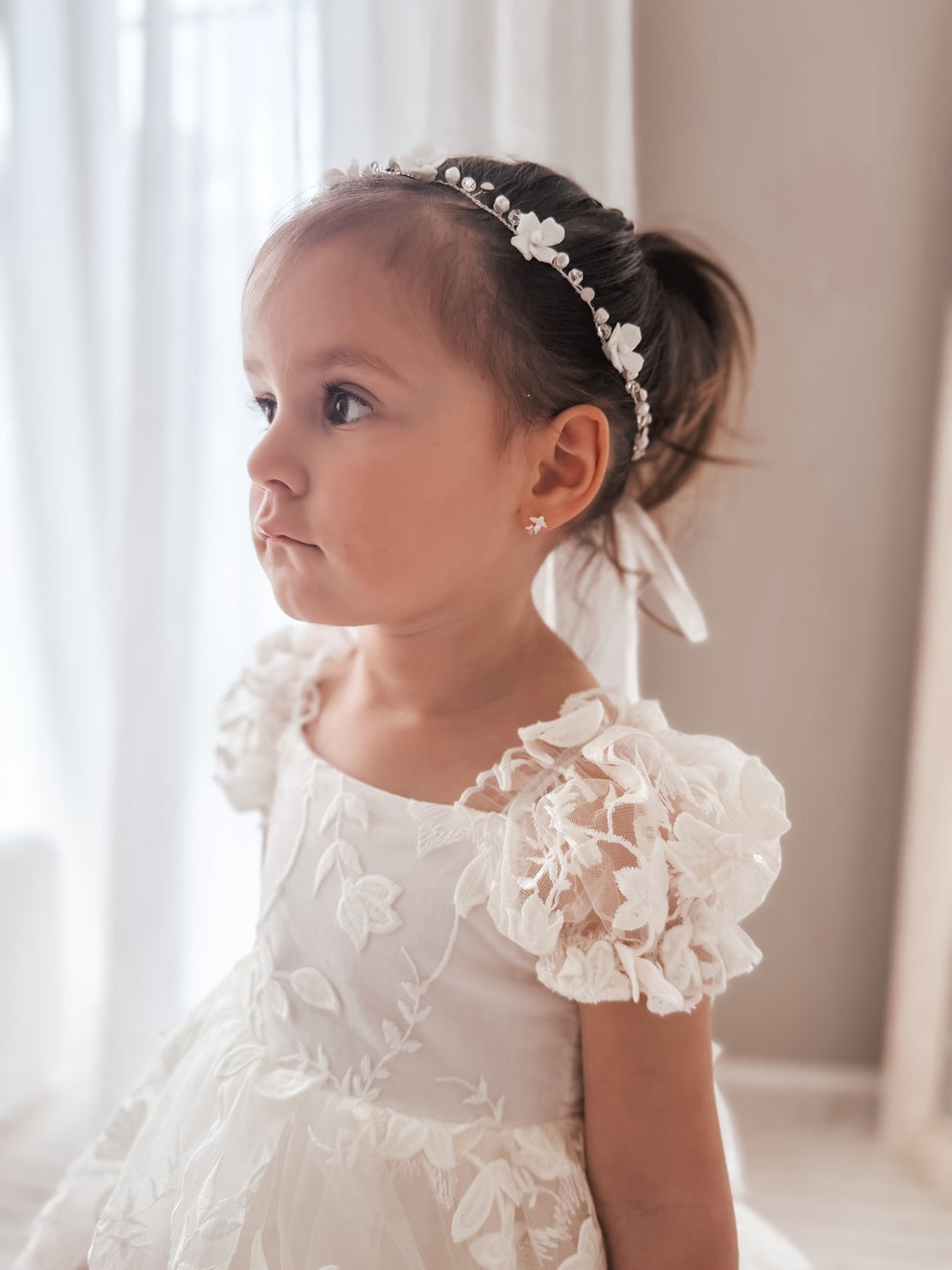 Close-up of Ever After Girls Silver Headpiece showing delicate porcelain flowers and clear beads