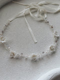 Ever After Girls Silver Headpiece flat lay – porcelain flowers, crystal beads, and silver wire design