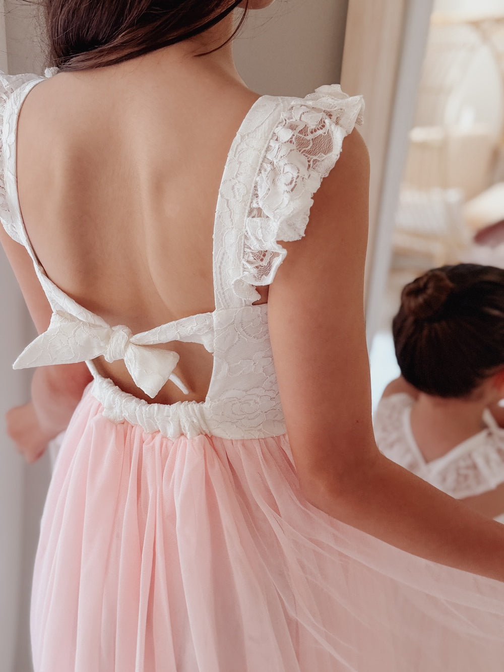 Tie up back on soft pink lace girls dress back view
