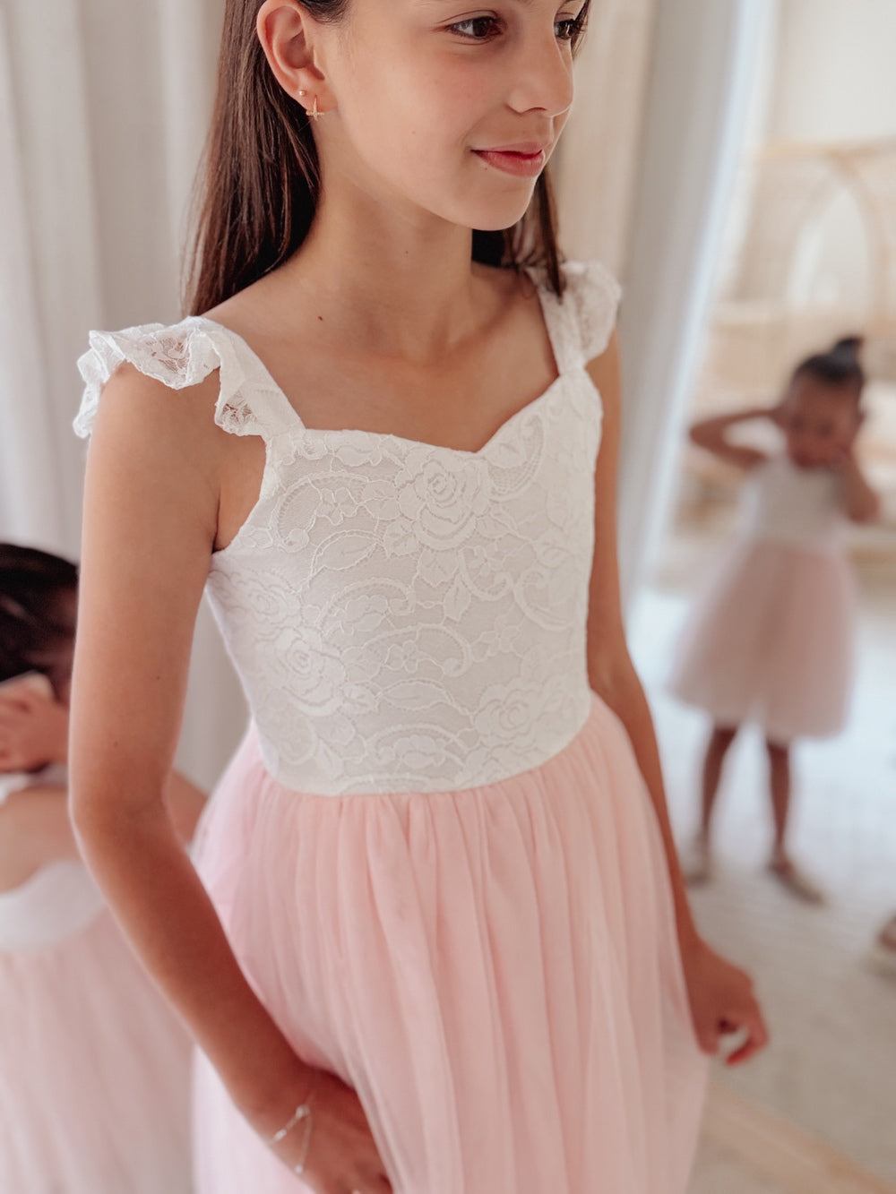 Lace bodice detail on soft pink girls occasion dress