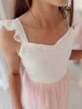 Lace bodice detail on soft pink girls birthday dress