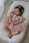 Baby girl birthday romper in soft nectar