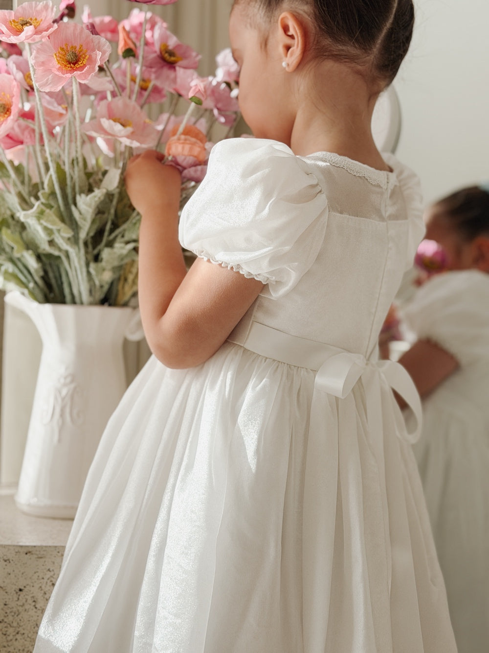 Little girls white baptism dress with soft shimmering fabric