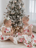 Detail shot of frill sleeve and tie-up back on Faith Christmas Rose Dress