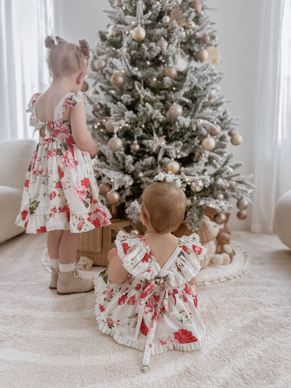 Faith Baby Girls Christmas Romper displayed with matching Faith Girls Floral Dress for coordinated sibling outfits