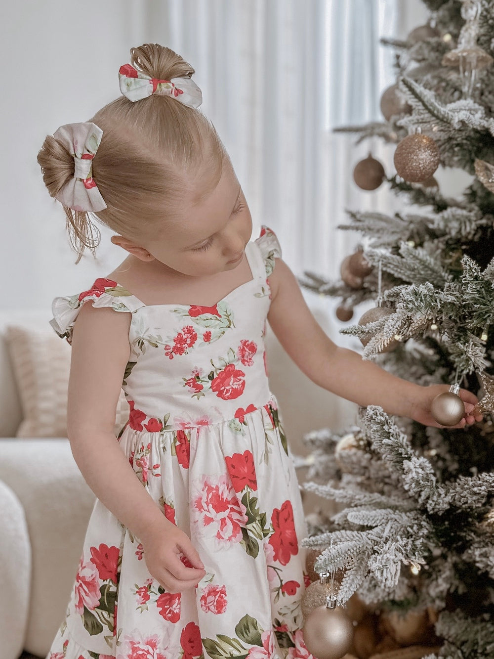 Faith Floral Pigtail Bows - Christmas Dresses and RompersClose-up of Christmas hair bows with red and green flower pattern