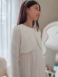 girls white jacket layered over formal dress