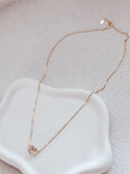 Girls gold necklace on display with linked circle charms