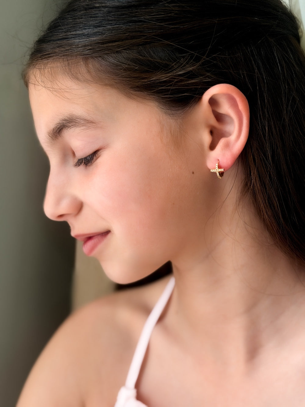 Side view of Girls Gold Cross Earrings – elegant gold hoops with sparkling cross pendants