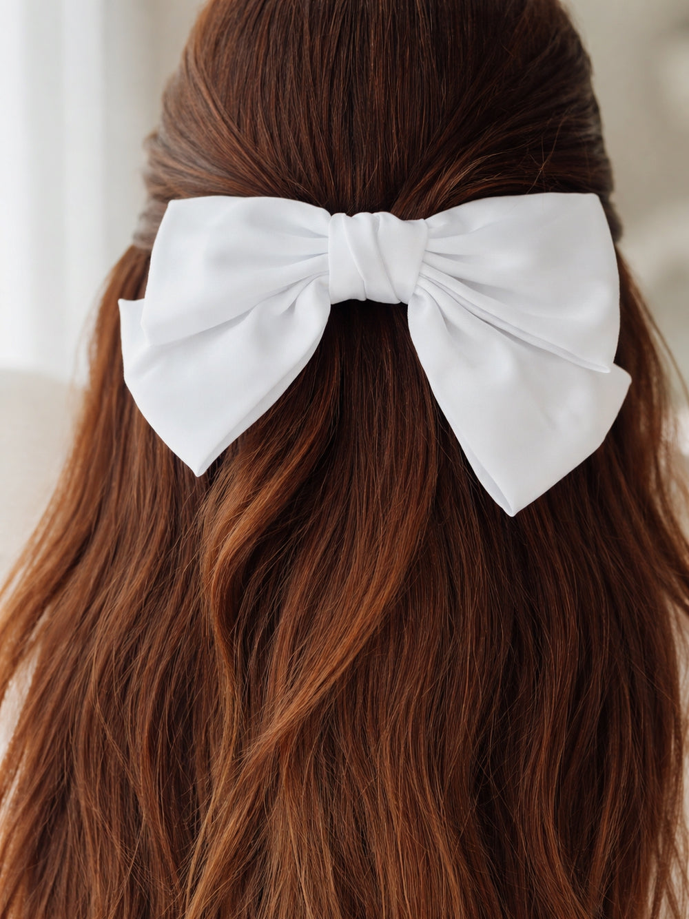Girls white satin bow for special occasions