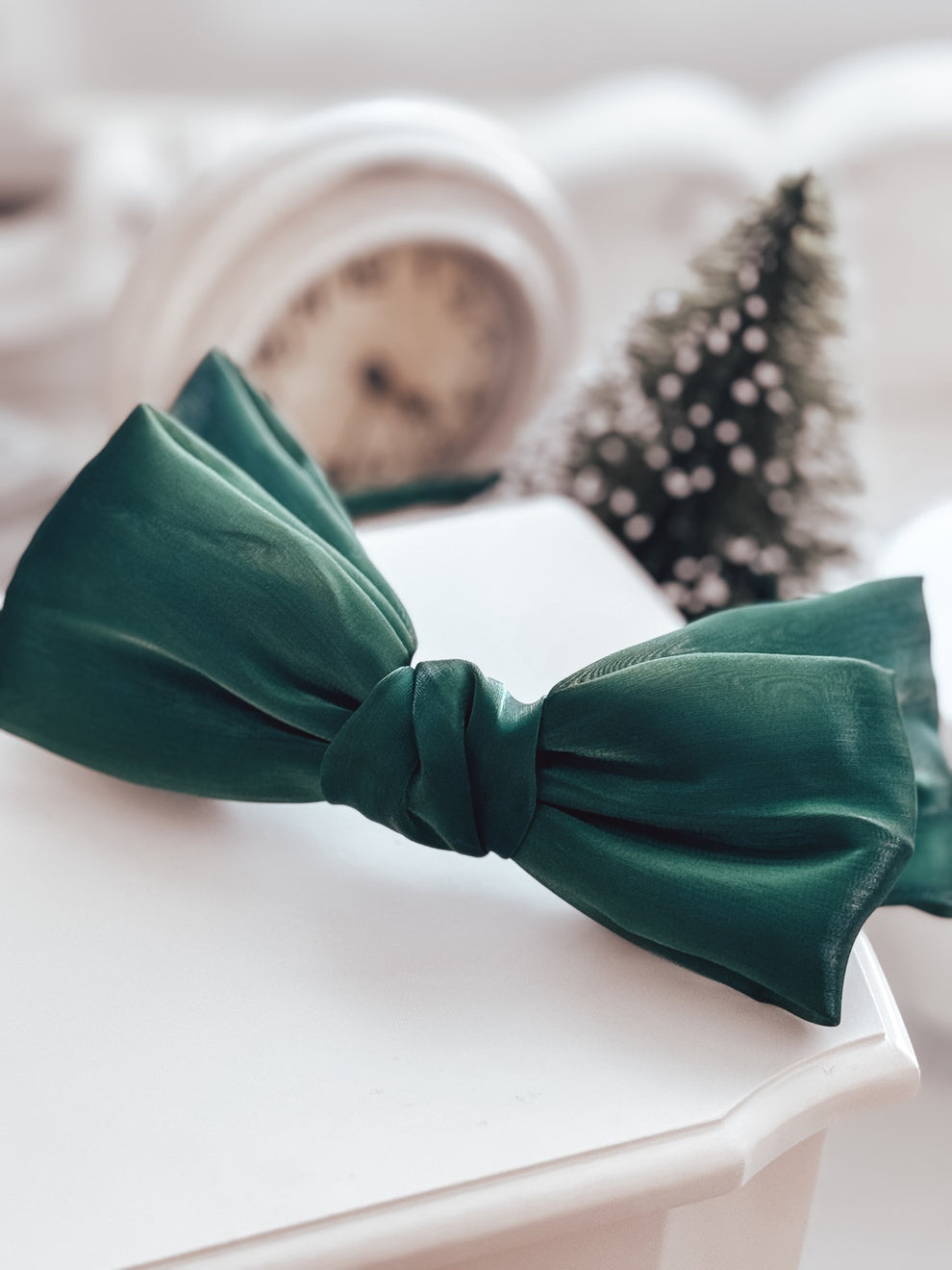 Match green bow headband with Christmas dress for perfect outfit