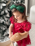 Large green bow on soft elastic headband – girls Christmas accessory