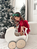 Girls Christmas headband featuring oversized green bow