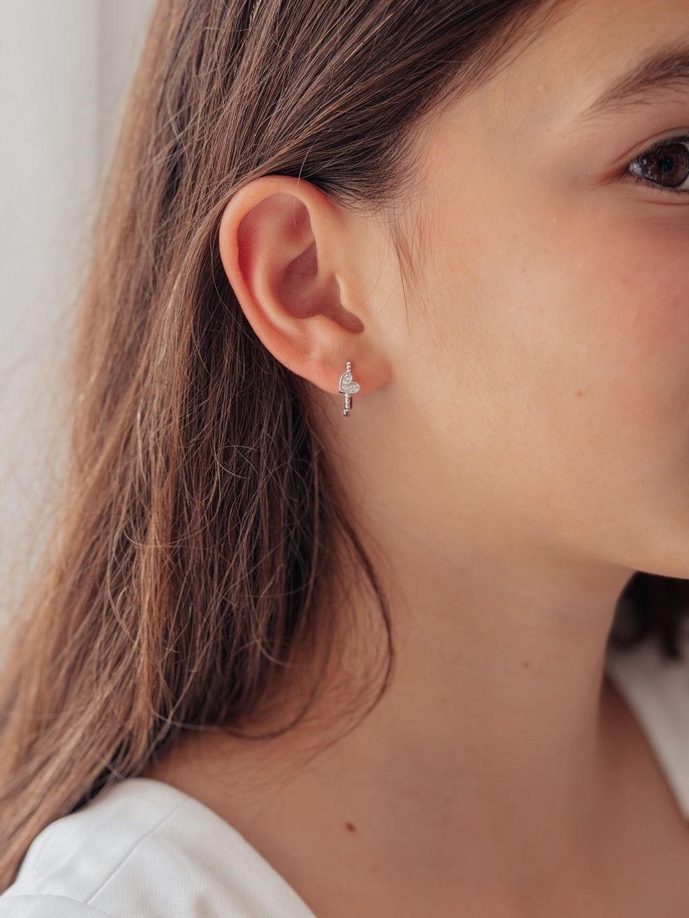 Girls silver hoop earrings with diamante heart charms