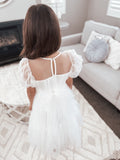 Pretty girls first communion dress with puff sleeves and button up back