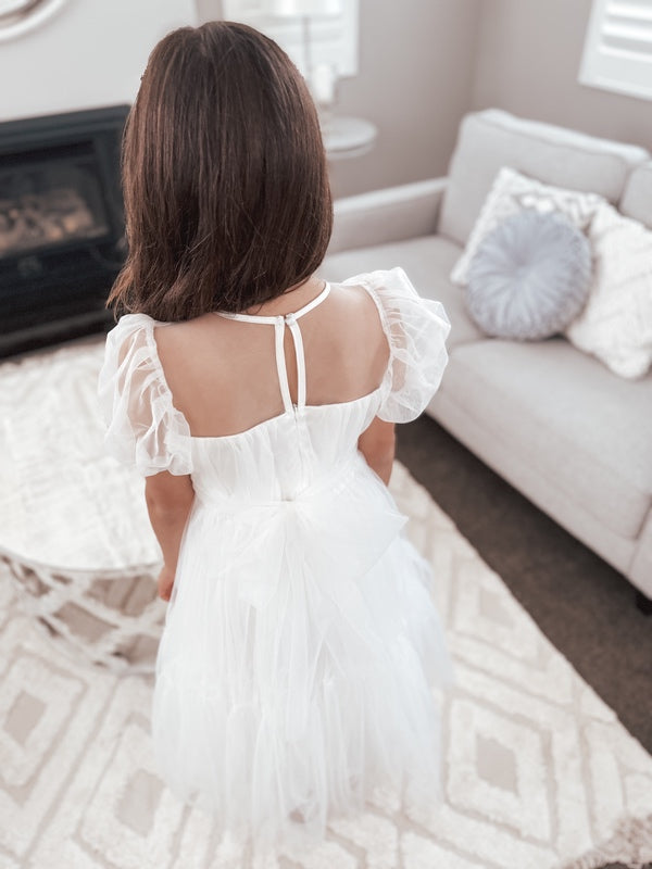 Pretty girls first communion dress with puff sleeves and button up back