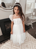 White communion dress with silver headpiece