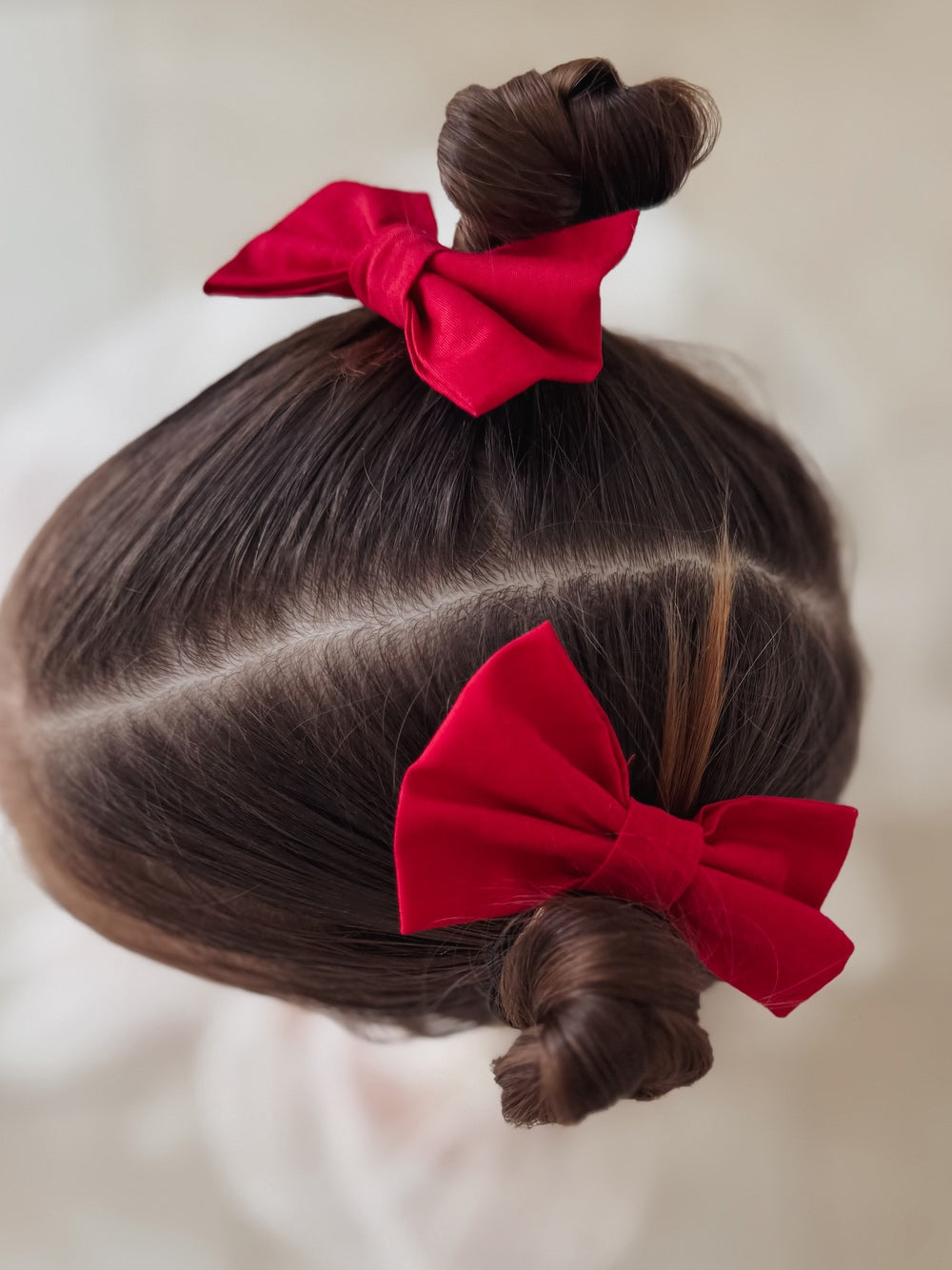 Pair of red bows for festive girls hairstyles