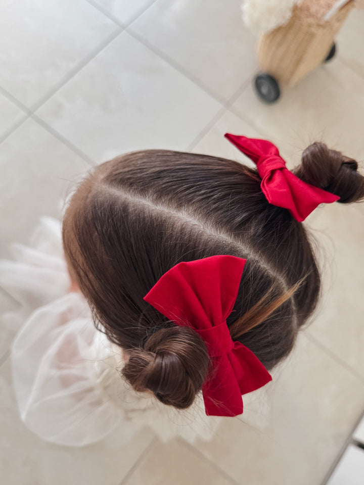 Holiday hair accessories in matching red ribbon