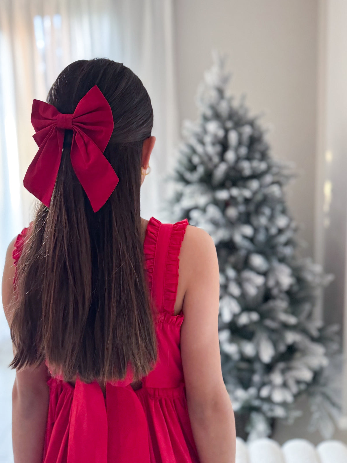Classic Christmas bow in red with structured tails and clip