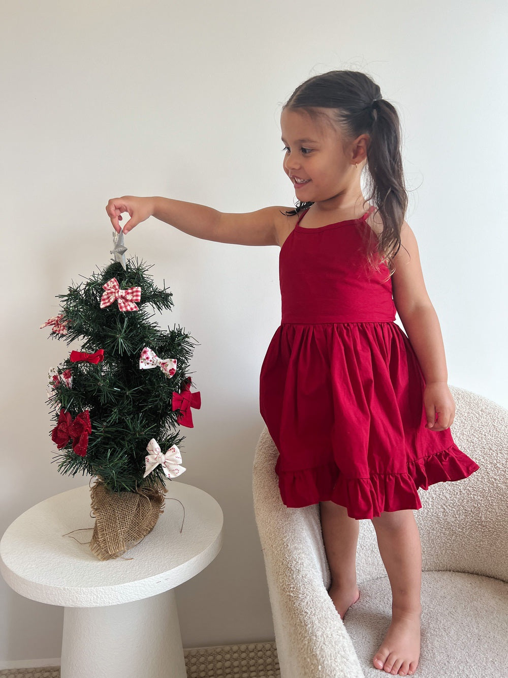Red girls Christmas dress with large back bow and soft flared cotton skirt