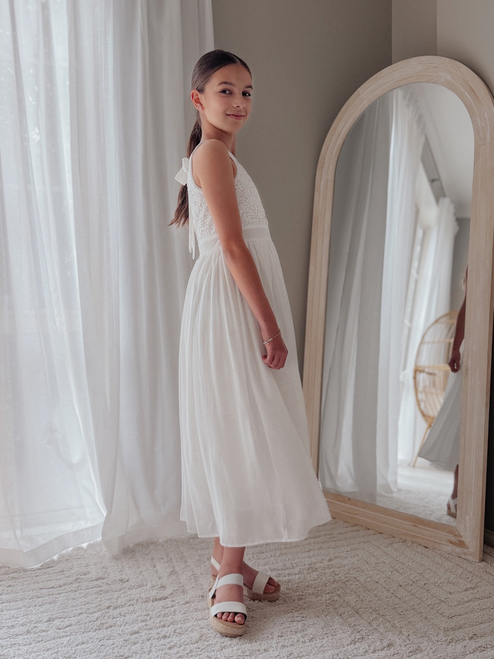 Elegant white girls dress for First Holy Communion photos