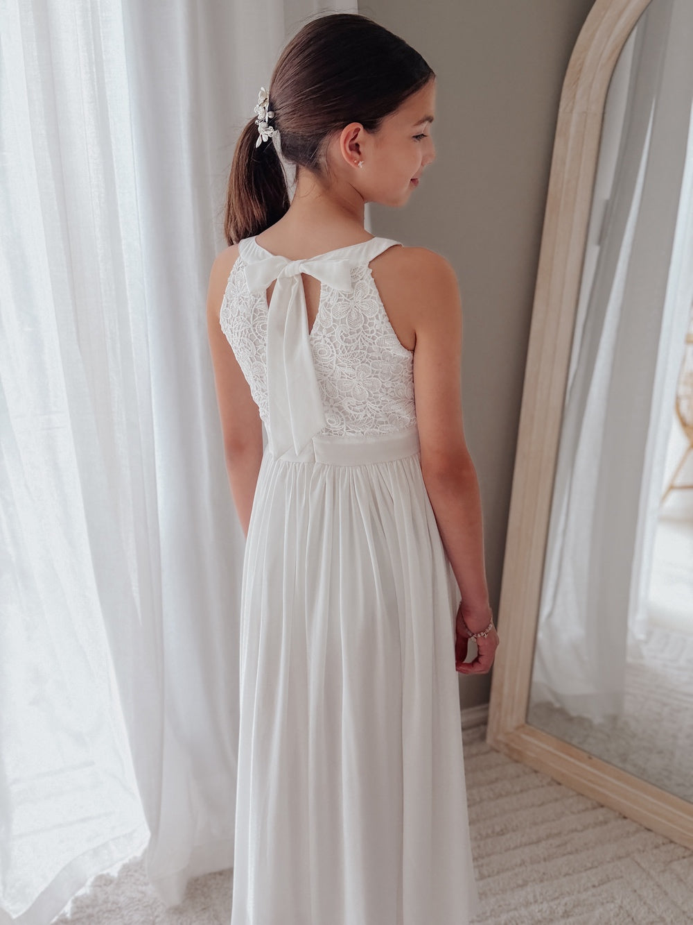 Girls White Communion dress with embroidered bodice, flowing skirt, and bow back