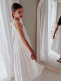 White flower girl dress for girls with embroidered bodice and flowing skirt
