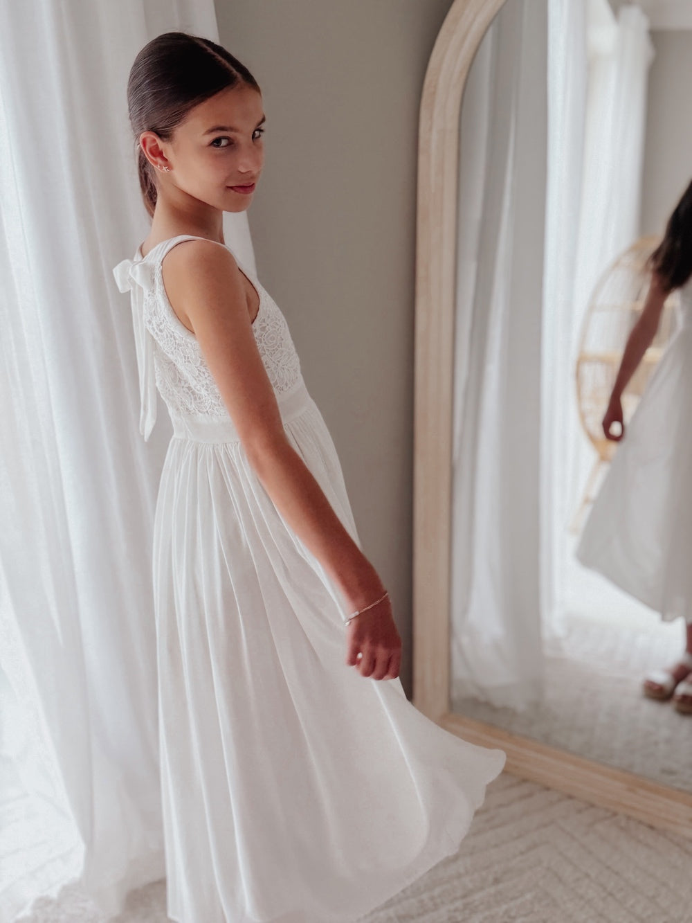 White flower girl dress for girls with embroidered bodice and flowing skirt